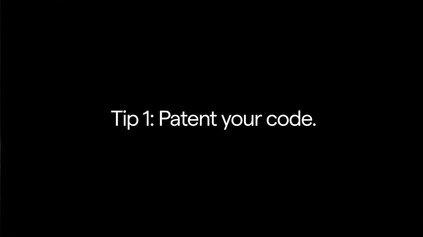 A black slide says, “Tip 1: Patent your code.” The speaker identifies it as a joke.