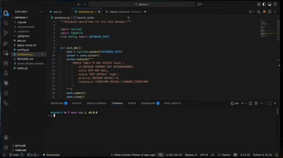 The editor displays Python code that initializes a task database.