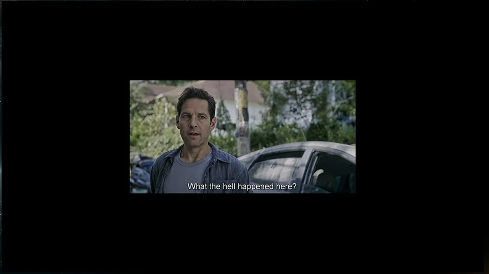 A film still of a man asking what happened.
