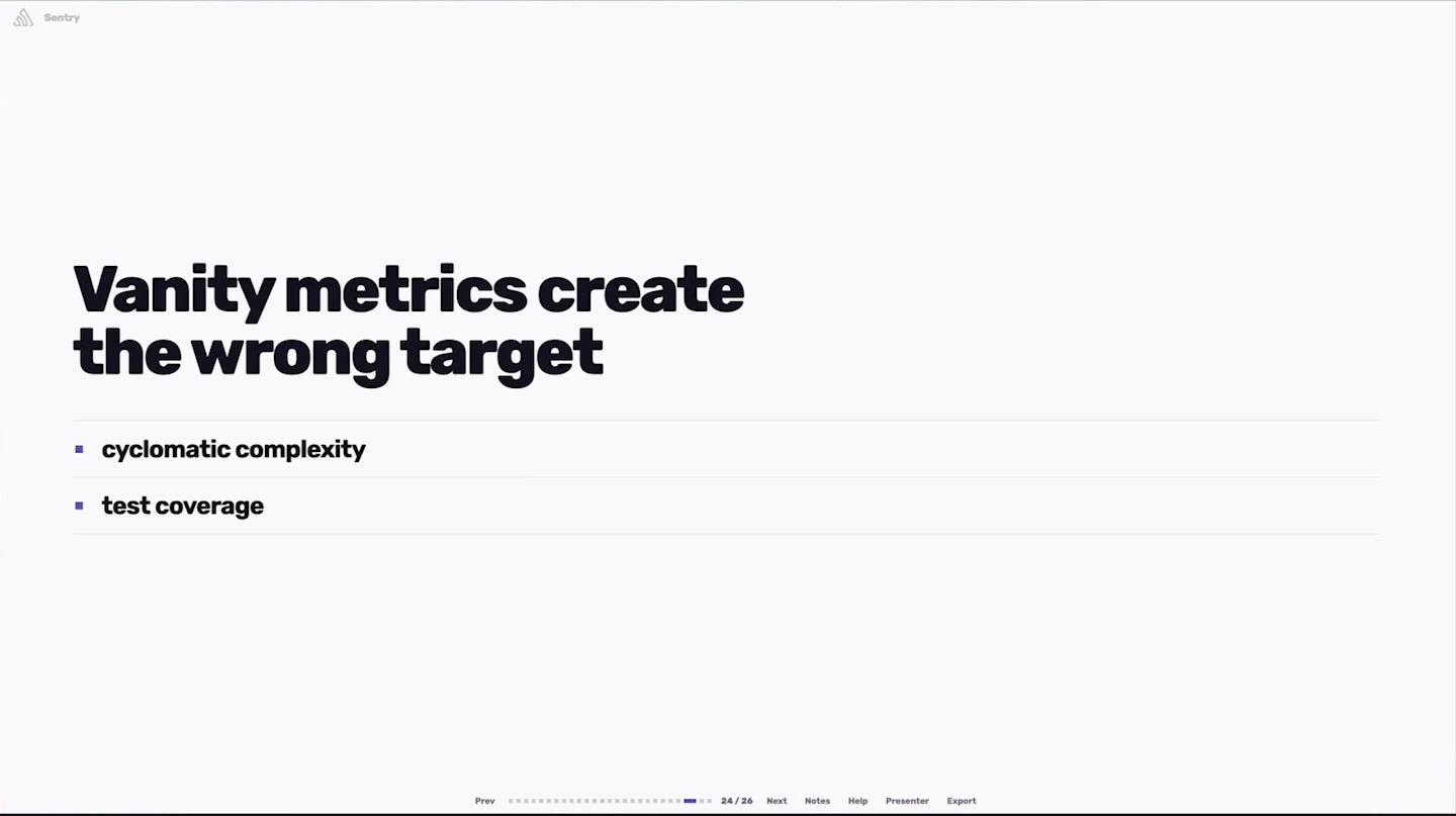 Cyclomatic complexity and test coverage are listed as examples of vanity metrics.